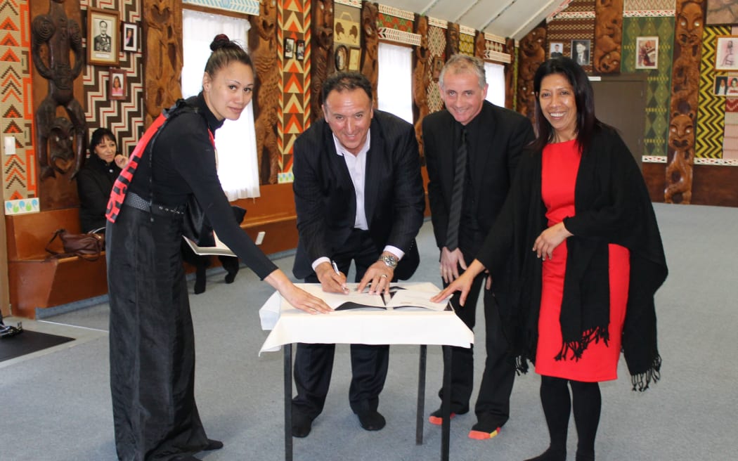 The co-chair of the new Te Matarau Education Trust,  Pita Tipene, and employer Lindsay Faithfull sign up to the   new trades training partnership  with Northtec  in Whangarei.