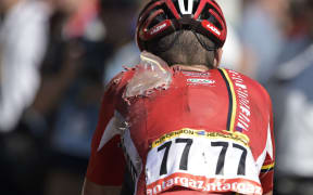 New Zealand's Greg Henderson was involved in a crash but crossed the finish line at the end of the third stage between  Antwerp and Huy.
