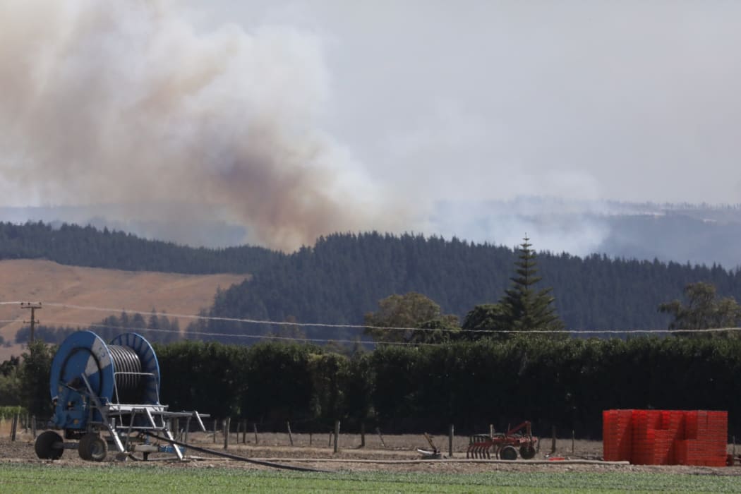 Clouds of smoke are seen rising from the bush fire area at Pigeon Valley this afternoon.