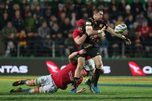 Stephen Donald of the Chiefs gets an offload away during the Rugby Union match - Chiefs v British & Irish Lions at FMG Stadium Waikato, Hamilton, New Zealand