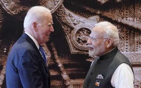 India's Prime Minister Narendra Modi (R) greets US President Joe Biden upon his arrival ahead of the G20 Leaders' Summit in New Delhi on September 9, 2023. (Photo by Evan Vucci / POOL / AFP)