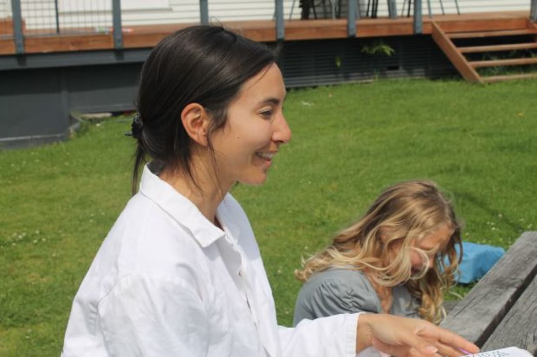A picture of Michelle Dickinson as Nanogirl in a suburban backyard in Auckland