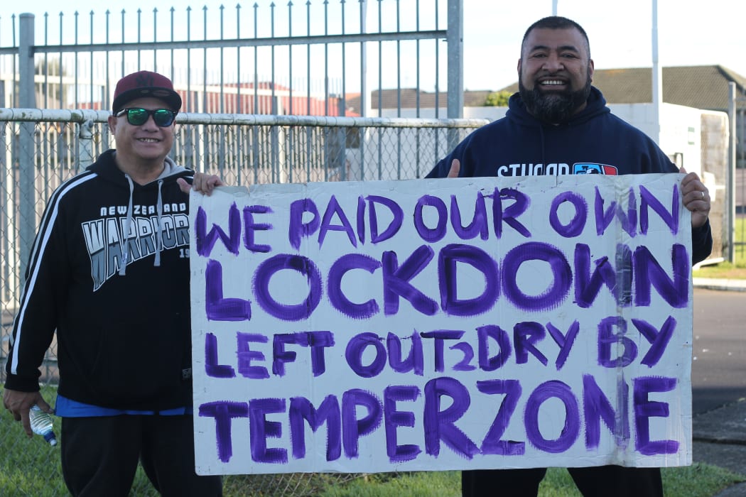 Afa Apoua and his uncle picketing outside Temperzone