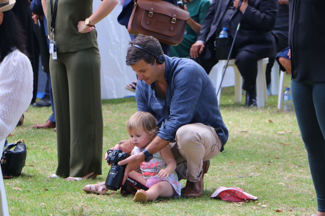 The Prime Minister's partner Clarke Gayford keeping their daughter Neve Te Aroha amused at Waitangi.
