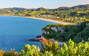 Sunset View of Cooks Beach from Shakespeare Cliff Lookout at Coromandel Peninsula, North Island, New Zealand.