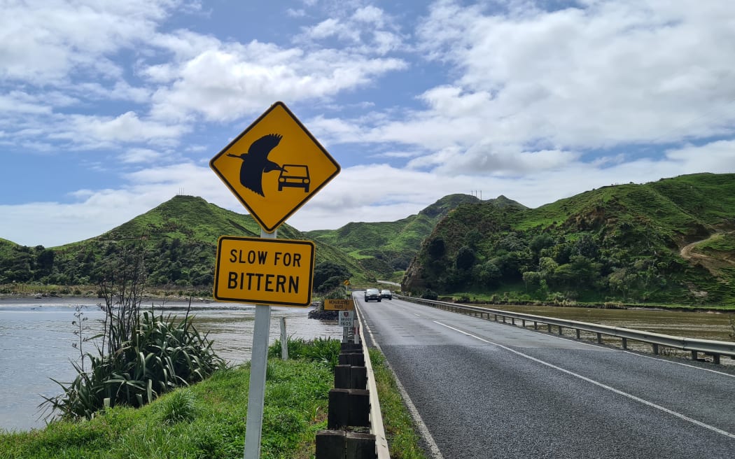 Road signs have been installed either side of the Mohakatino bridge on SH3 near Mōkau, urging drivers to slow down for bittern.