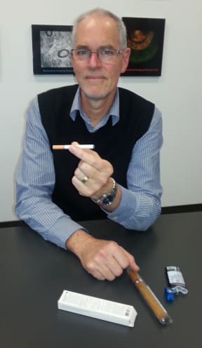 A photo of Chris Bullen with some e-cigarette