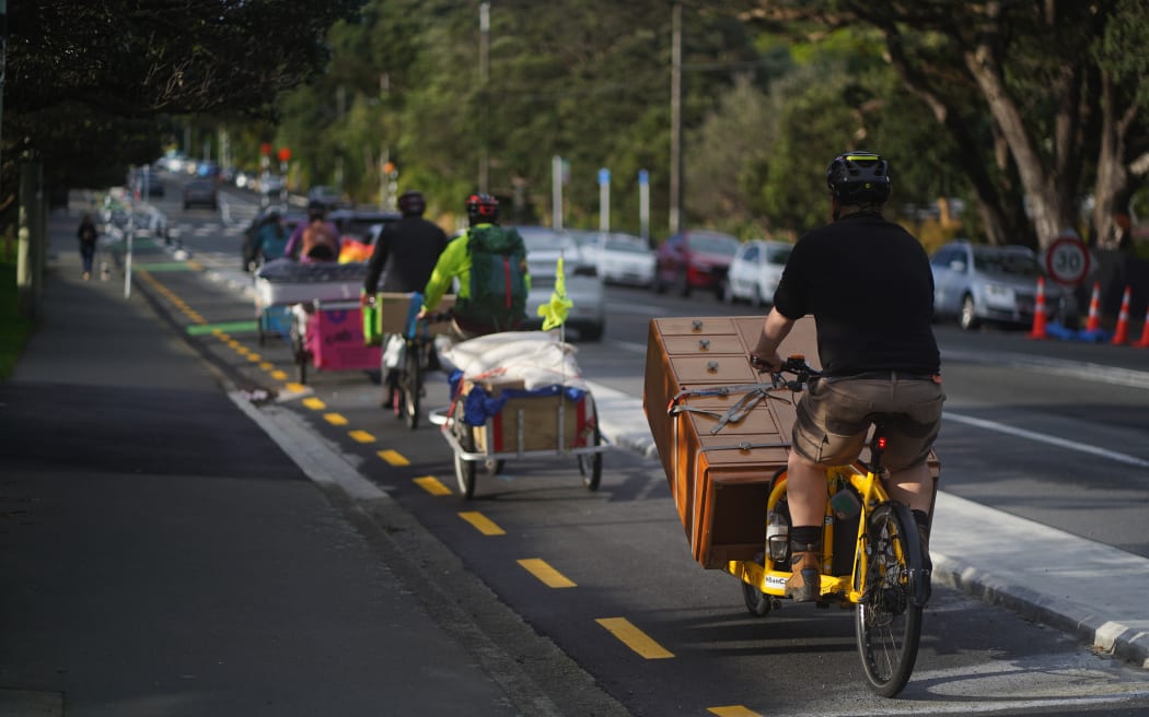 A convoy of cargo bikes ferries Beth Walker's possessions to her new flat in Newtown.
