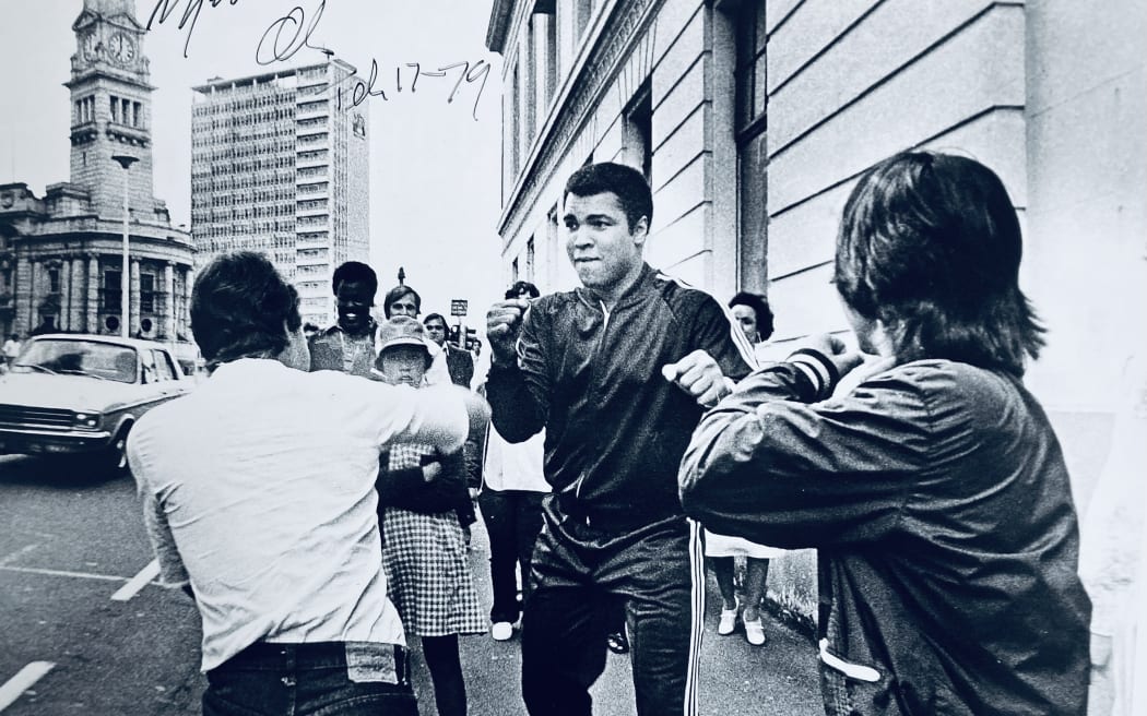 Muhammad Ali sparring with a couple lads on Queen St in 1979