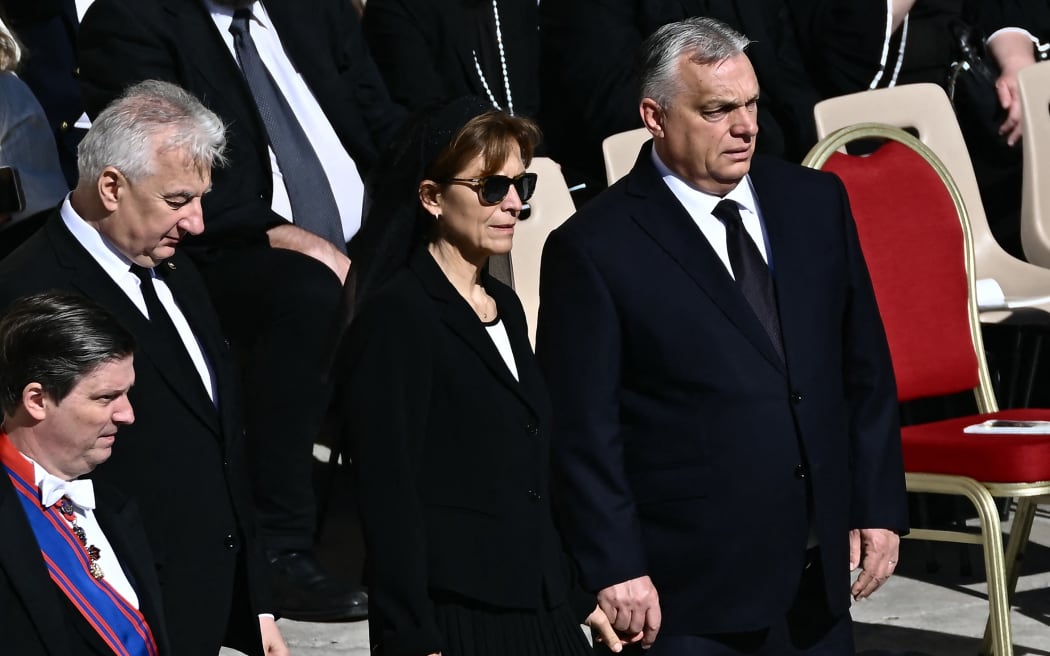 Hungary's Prime Minister Viktor Orban (R) and his wife Anikó Lévai arrive ahead of the late Pope Francis' funeral ceremony at St Peter's Square at the Vatican on April 26, 2025. (Photo by Filippo MONTEFORTE / AFP)