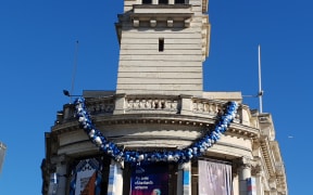 The Ei hangs on the Auckland Town Hall clock tower.