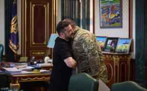 This handout photograph taken and released by the Ukrainian Presidential Press Service on June 1, 2025 shows Ukrainian President Volodymyr Zelensky (L) greeting the head of Ukraine’s Security Service Vasyl Malyuk (R) in Kyiv, amid the Russian invasion of Ukraine. Ukraine said on June 1, 2025 it launched a "large-scale" attack against Russian military aircraft on the same day, hitting a base in eastern Siberia thousands of kilometres (miles) from its border, a source within the Ukrainian security services said. (Photo by Handout / UKRAINIAN PRESIDENTIAL PRESS SERVICE / AFP) / RESTRICTED TO EDITORIAL USE - MANDATORY CREDIT "AFP PHOTO / UKRAINIAN PRESIDENTIAL PRESS SERVICE" - NO MARKETING NO ADVERTISING CAMPAIGNS - DISTRIBUTED AS A SERVICE TO CLIENTS