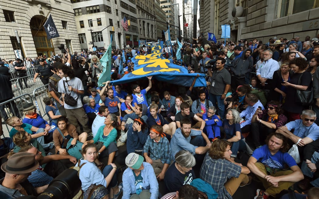 Climate change protesters clogged up Wall Street ahead of the UN summit on Monday.