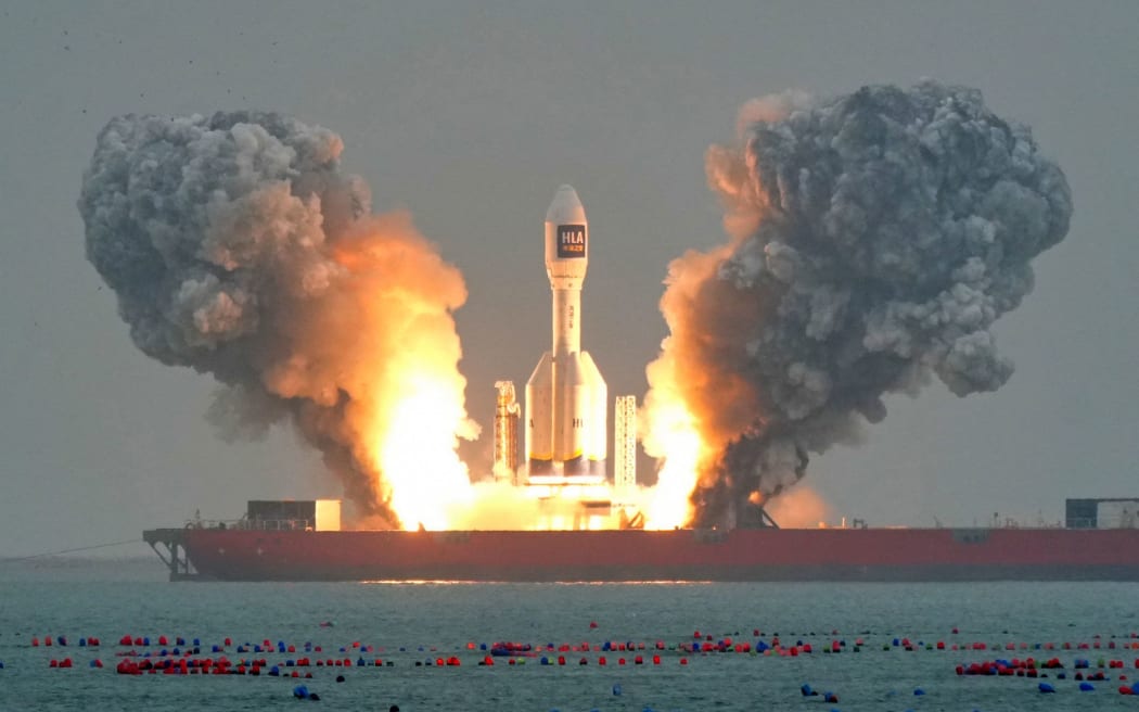 A Gravity-1 rocket lifts off from a launch ship in the waters off of China's eastern Shandong province on October 11. The rocket was making its second launch and carried a wide-field satellite and two experimental satellites into orbit.