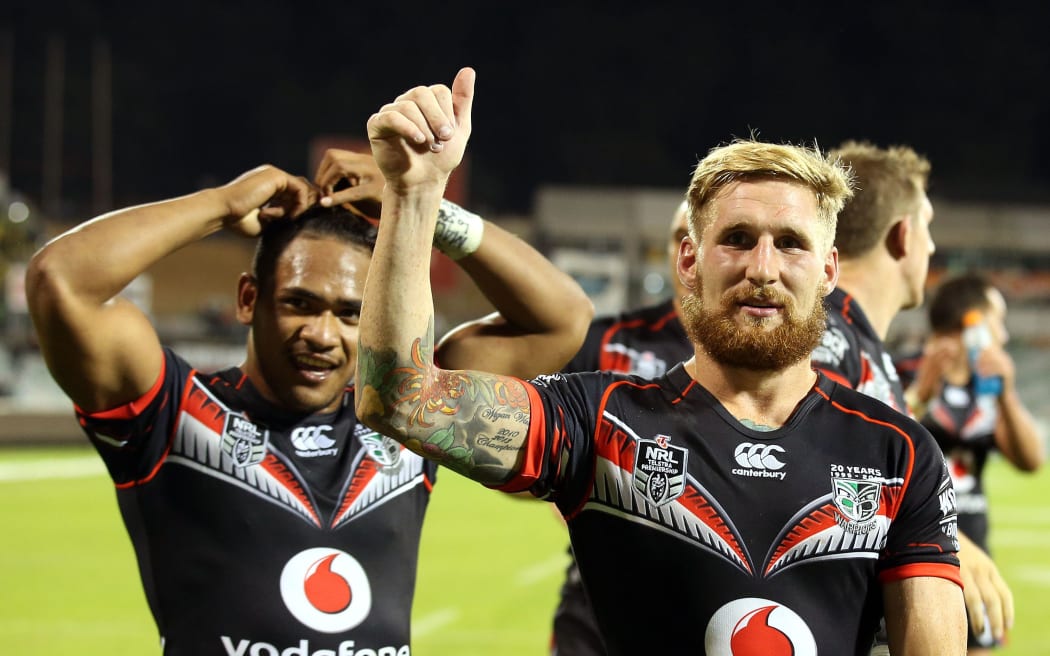 Sam Tomkins and Solomone Kata celebrate a Warriors win.
