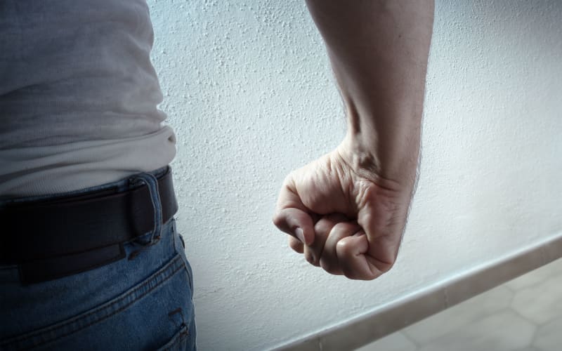 Man with curled fist - generic domestic violence image.