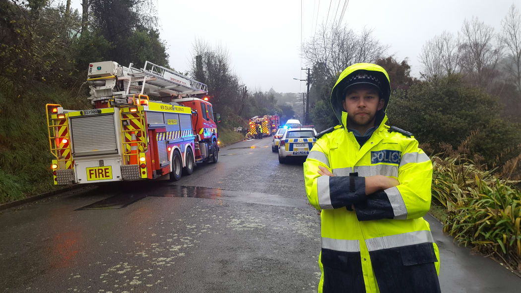 Emergency services at scene of fatal fire in Murphy St which is cordoned off.