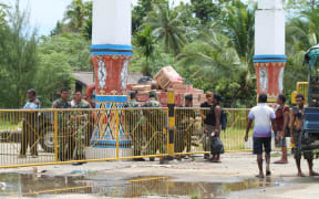 Indonesian military guard the border with Papua New Guinea at Wutung,