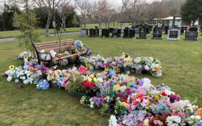 Dozens of flowers were moved from graves at Akatārawa Cemetery in Upper Hutt.