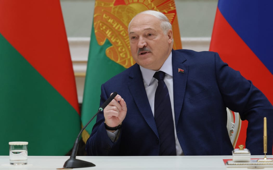 In this pool photograph distributed by the Russian state agency Sputnik, Belarus' President Alexander Lukashenko attends a signing ceremony with Russia's President during a meeting of the Supreme State Council of the Union State of Russia and Belarus, at the presidential palace in Minsk on December 6, 2024.