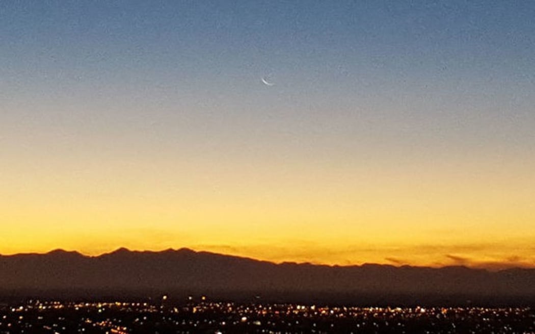 The waning crescent moon rising over Christchurch signals the beginning of Ramadan