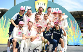 Australia celebrate with the Border-Gavaskar trophy after winning the fifth test against India at the Sydney Cricket Ground, January 5, 2024.