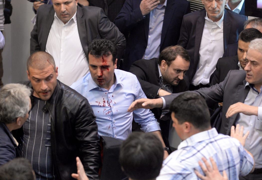 Opposition Social Democrats leader Zoran Zaev bleeds after being injured in the brawl.