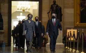 Clerk of the House Cheryl Johnson leads the Democratic House impeachment managers through Statuary Hall to deliver the article of impeachment to the Senate.