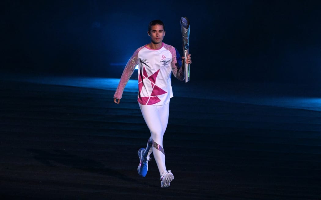 The Commonwealth Games baton enters the stadium.