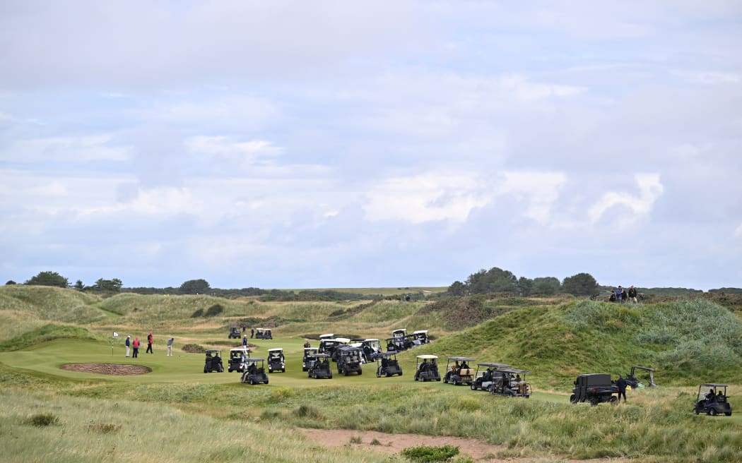 Golf buggy’s are pictured on a course at the Trump Turnberry Golf Courses whilst US President Donald Trump plays, in Turnberry on the south west coast of Scotland on July 26, 2025, during the second day of his visit to the country, since his second tenure as President began. The Presidents visit to Scotland's picturesque Turnberry underlines the US president's long-held desire to host golf's illustrious British Open at the famous course, despite numerous stumbling blocks. (Photo by ANDY BUCHANAN / AFP)