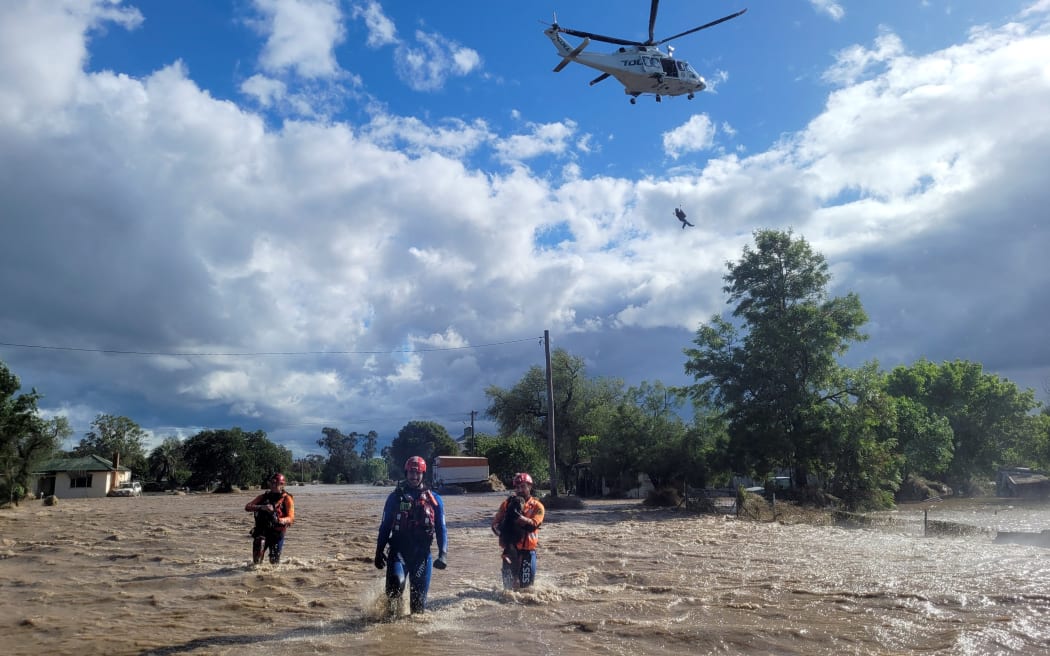 New South Wales State Emergency Service (SES) officials involved in rescue work in the flooded towns around the overflowing Wyangala Dam near Cowra. Australia's east coast has been repeatedly swept by heavy rainfall in the past two years, driven by back-to-back La Nina cycles.
