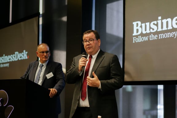 Pattrick Smellie (left) watches finance minister Grant Robertson at the Auckland launch of BusinessDesk subscriber service on Wednesday.