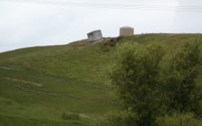 The 2016 earthquake left these water tanks somewhat at odds.