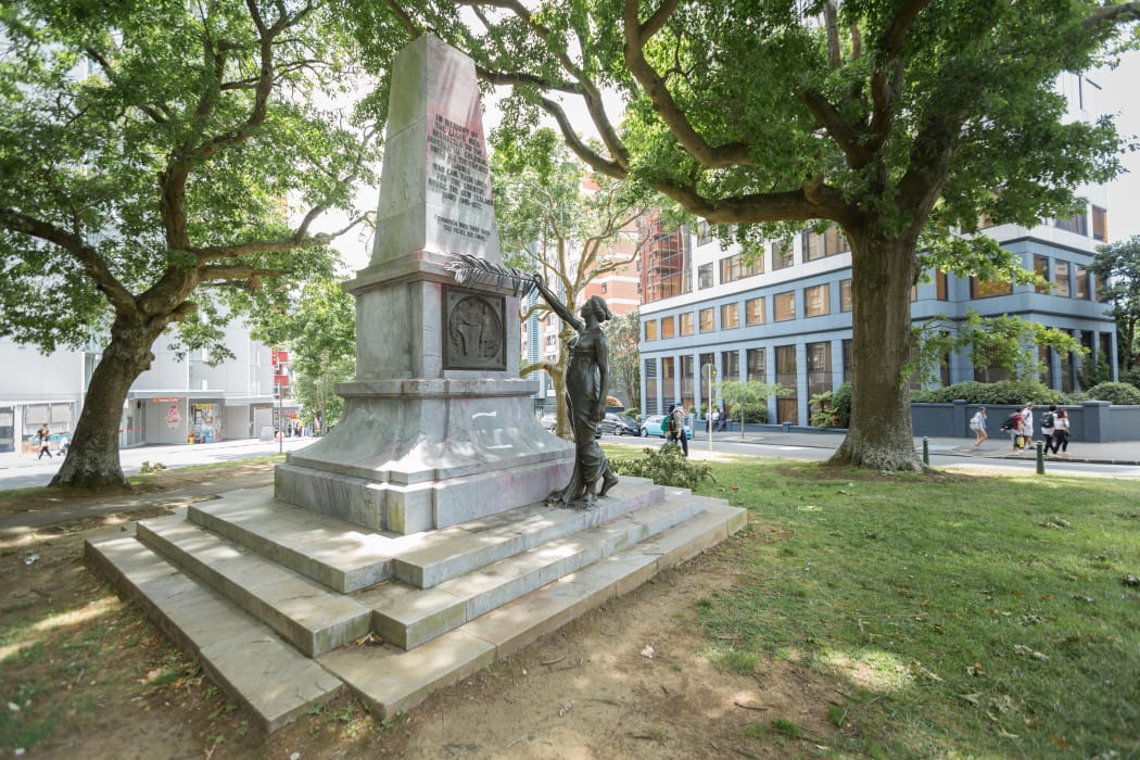 no captionThe war memorial on the corner of Symonds Street and City Road in Auckland. Overnight a group attached an axe to her head and a poster to the plaque that reads: "Fascism and White Supremacy are not Welcome Here".