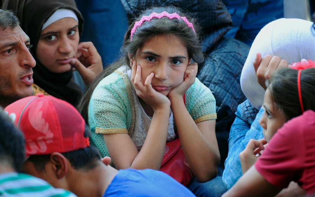 Migrants are seen outside the Eastern (Keleti) railway station in Budapest on September 1, 2015. Hungarian authorities closed the station earlier.