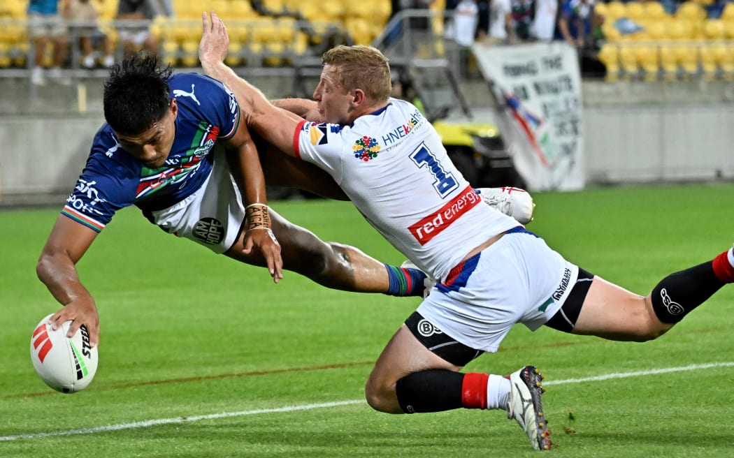 Edward Kosi of the  New Zealand Warriors scores a try during the NRL Premiership