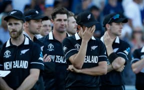 Dejected New Zealand players with captain Kane Williamson (left) after 2019 World Cup final loss.