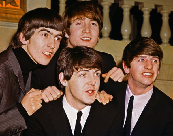 The Beatles' George Harrison, John Lennon (top), Paul McCartney (bottom), and Ringo Starr in 1964.