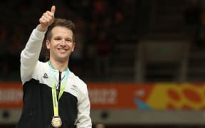 Aaron Gate on the podium during the medal presentation ceremony for the men's 1000m time trial cycling event at the Commonwealth Games on 1 August 2022.