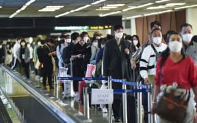 Tourists wear masks at Don Mueang Airport, in Bangkok, Thailand, 07 February 2020.
