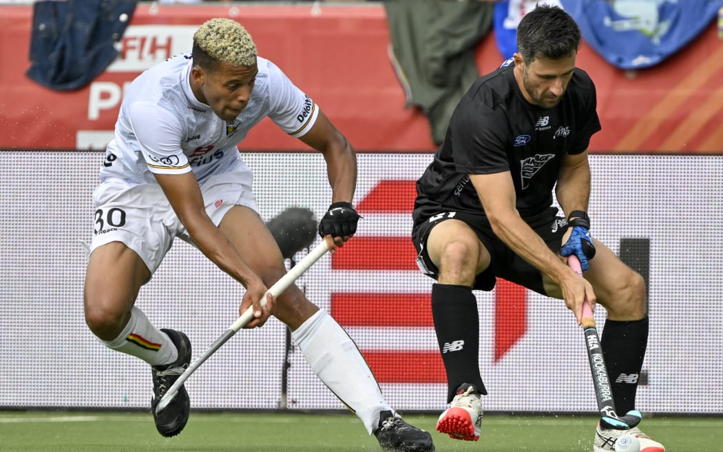 Belgium's Nelson Onana (L) and New Zealand's Kane Russell compete during a hockey game between Belgian national team Red Lions and New Zealand, in the group stage of the 2023 Men's FIH Pro League in Antwerp on June 18, 2023. (Photo by DIRK WAEM / Belga / AFP) / Belgium OUT