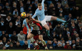 Manchester City's Kevin De Bruyne climbs high