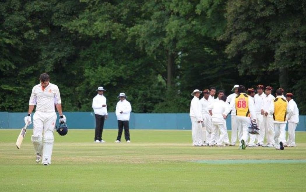 Papua New Guinea players celebrate a wicket in their four-day match against the Netherlands.