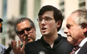 Former pharmaceutical executive Martin Shkreli speaks to the media in front of the US District Court for the Eastern District of New York with members of his legal team after the jury issued a verdict, 4 August 2017.