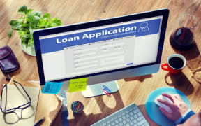 computer with loan sign on it