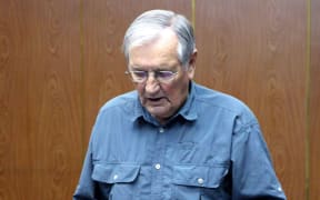 North Korea released images showing Merrill Newman reading his alleged apology.