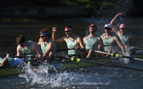 Cambridge crew celebrate their win over Oxford at the finish of the 166th annual men's boat race between Oxford University and Cambridge University on the River Great Ouse in Ely, eastern England, on April 4, 2021.