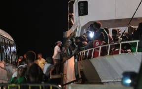 Solomon Islands voters board the MV Taimareho 1 in the capital Honiara bound for West Are Are constituency in Malaita . 14 April 2024