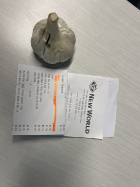 The price of garlic $1.75 for one head of garlic from New World Mount Roskill, in March 2025. 