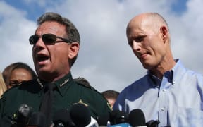 Broward County Sheriff, Scott Israel (C), Florida Governor Rick Scott.